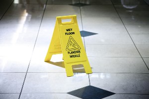 wet floor sign portraying premises liability